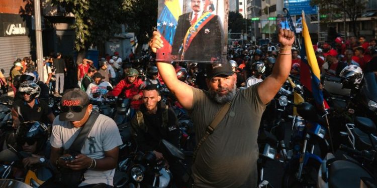 Mobs of motorcycle-riding armed militia hunt Venezuelan streets for Trump supporters as crackdown intensifies